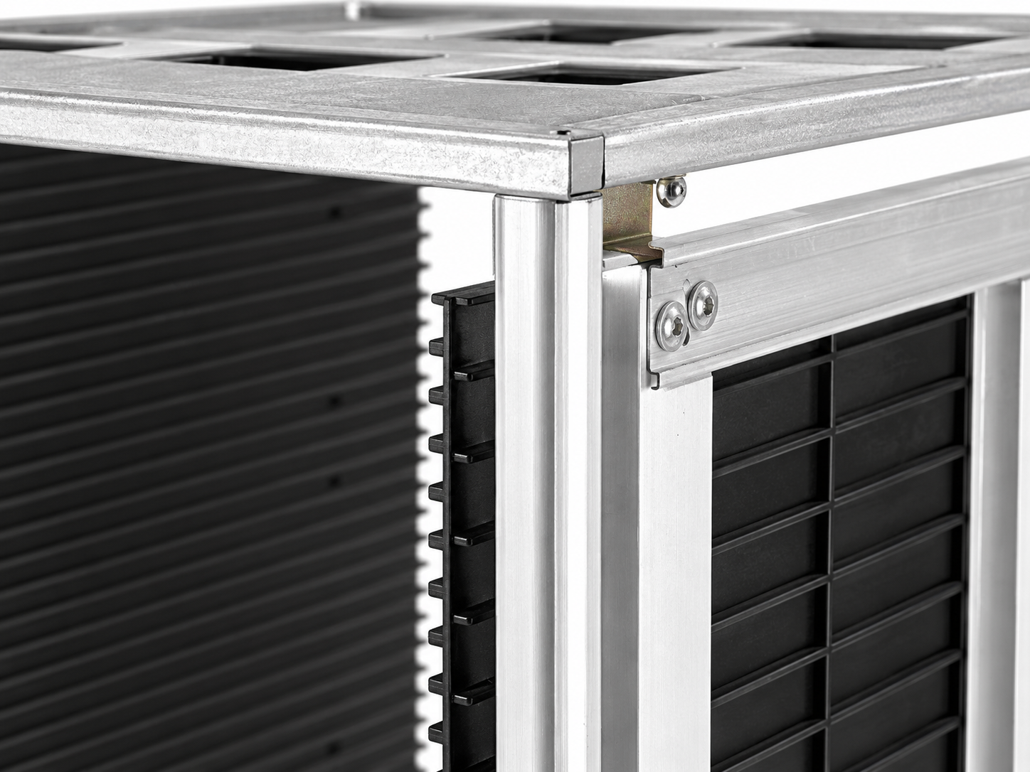 Close view of silver frame joint and black slotted panel in an ESD PCB magazine rack