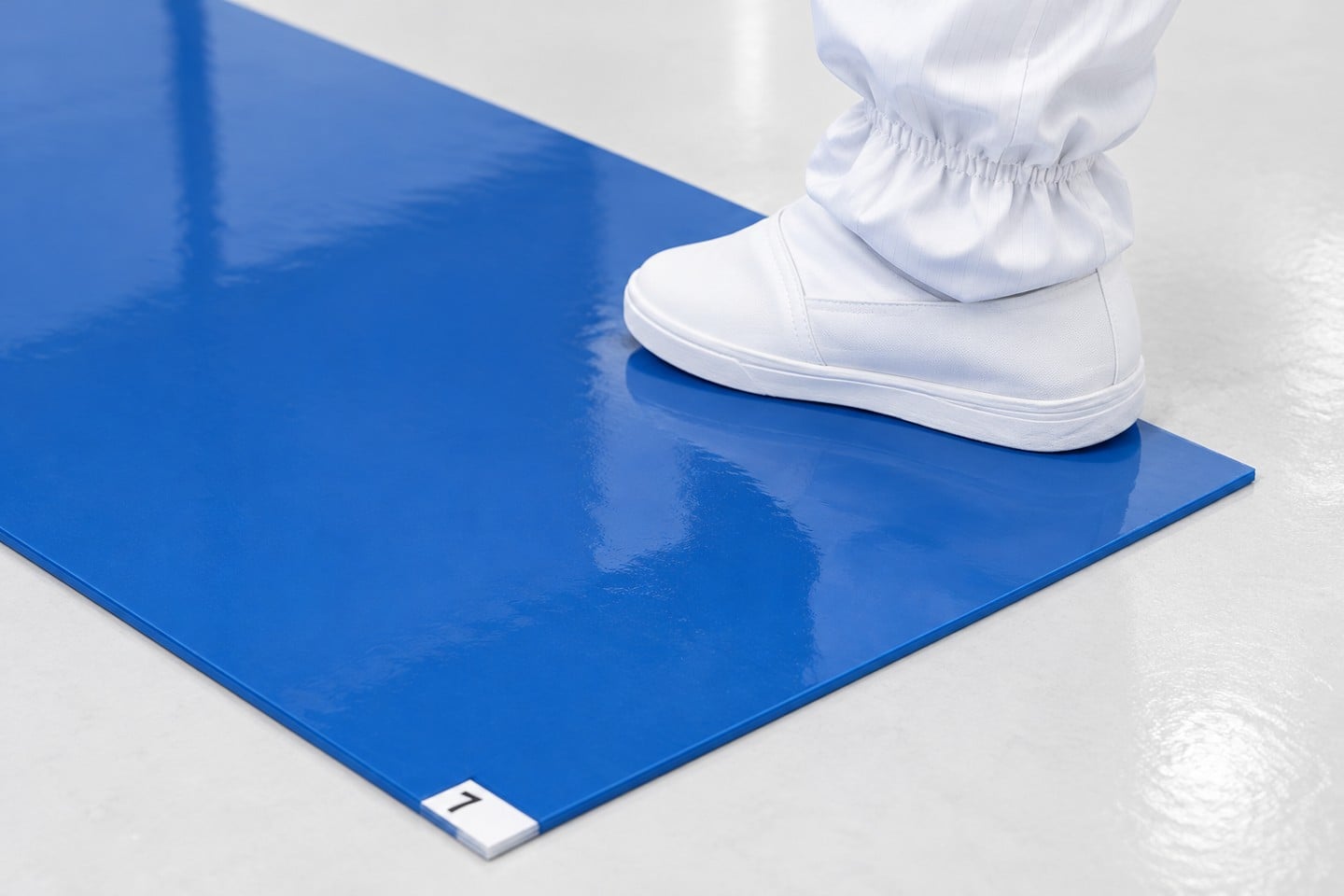 Blue SWESD sticky mat inspected beside a cleanroom overshoe