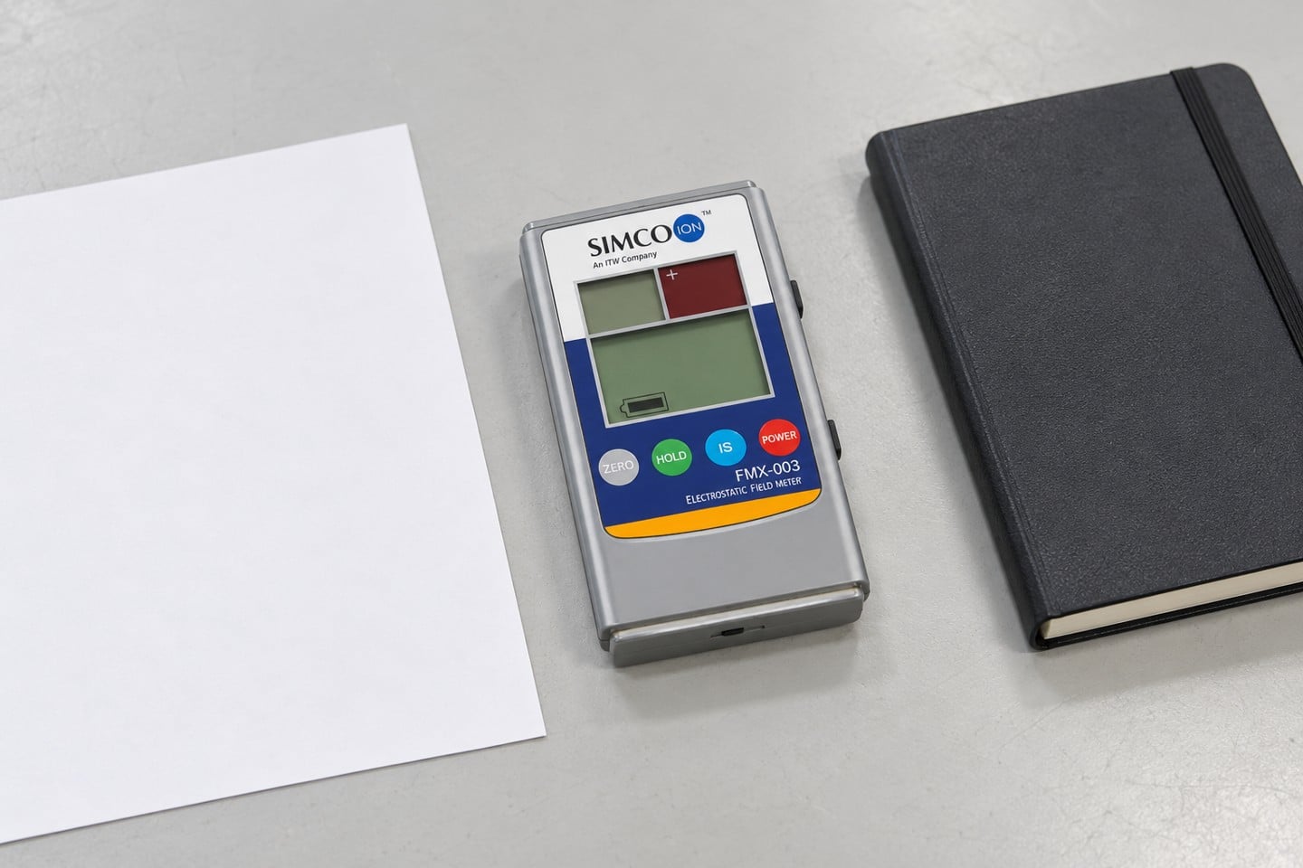 SWESD field meter beside a positioning checklist on an uncluttered bench