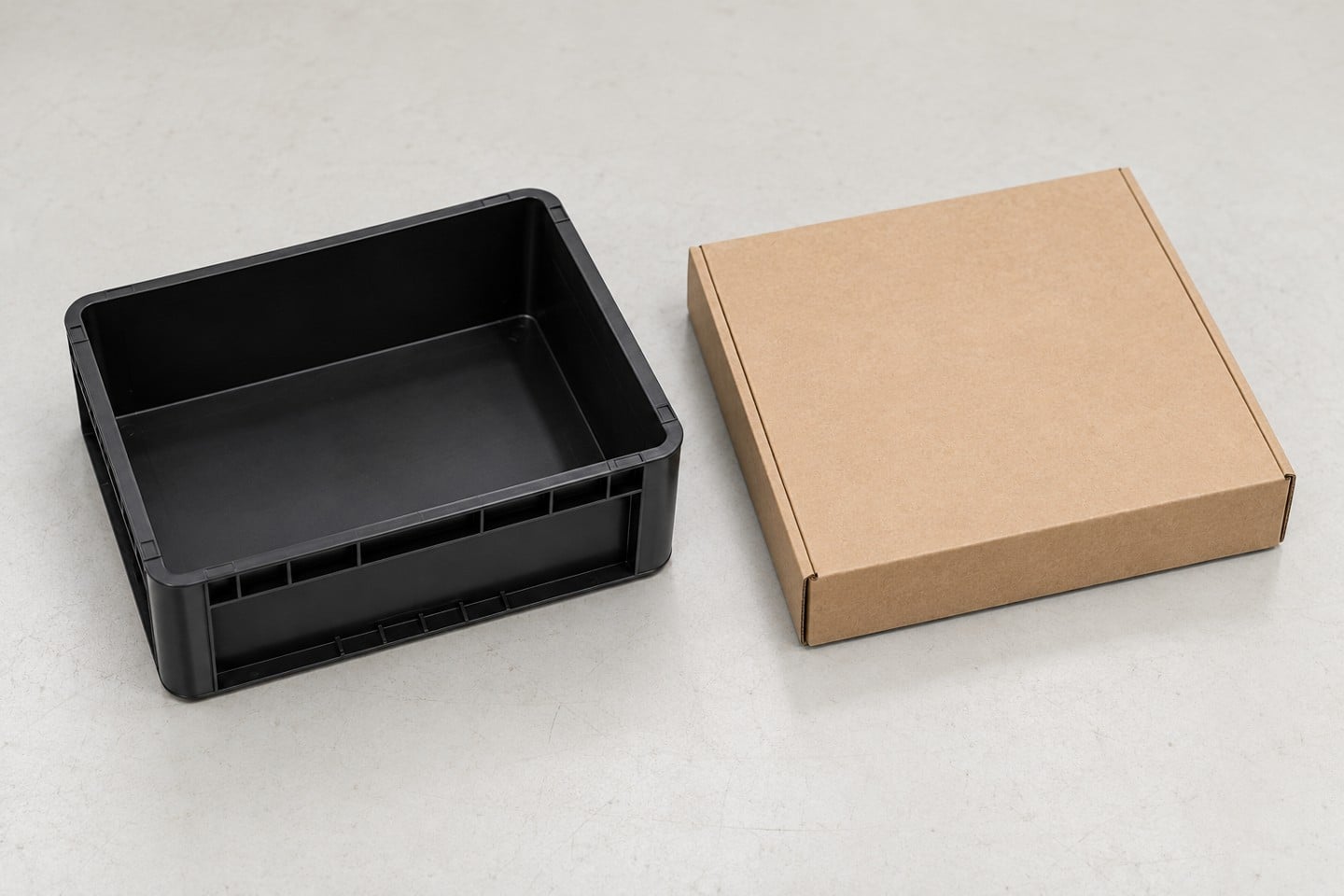 Empty SWESD box beside a separate unmarked cardboard package