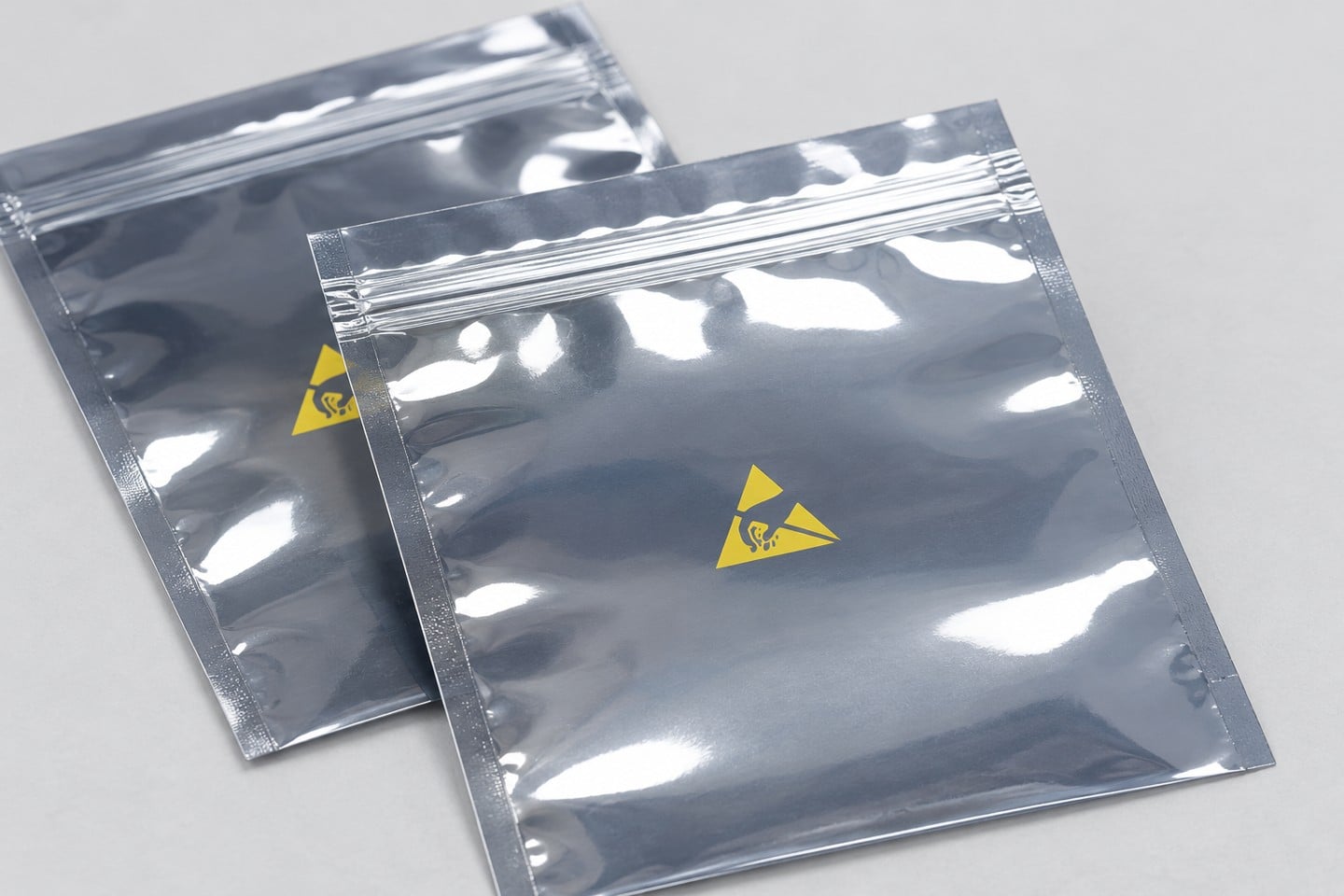 Resealable zipper and sealed edge of a closed SWESD shielding bag