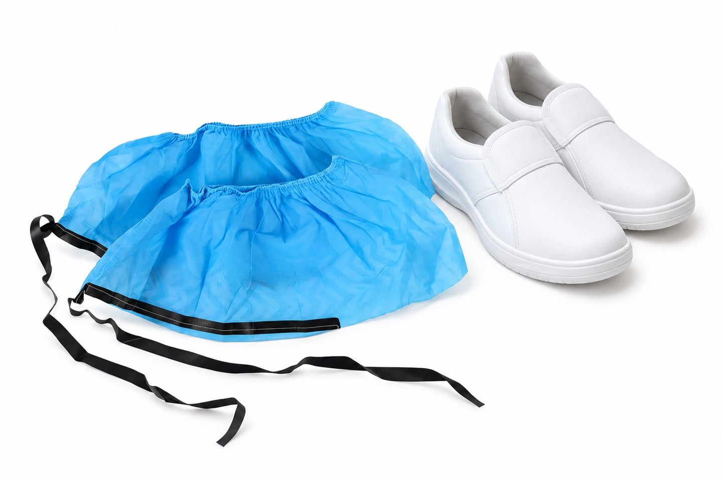 Blue shoe covers beside plain example cleanroom shoes