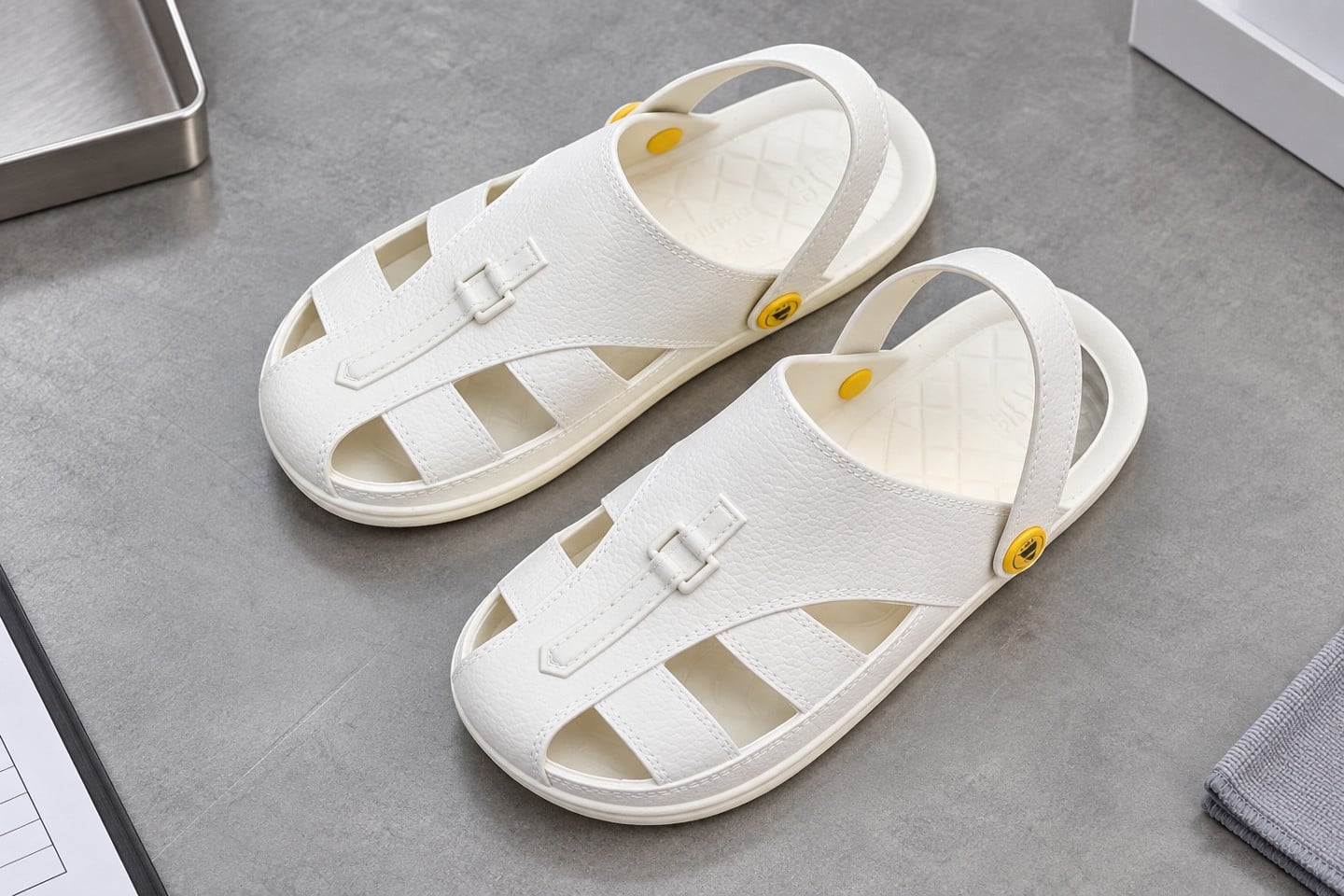 Upper straps and heel retention of a SWESD white sandal