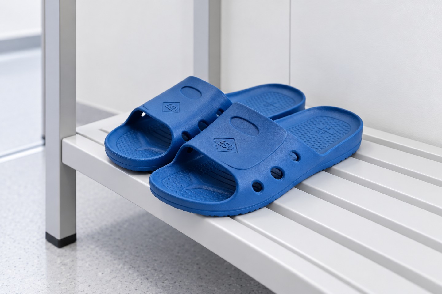 SWESD blue ESD slides stored on a changing-room shelf
