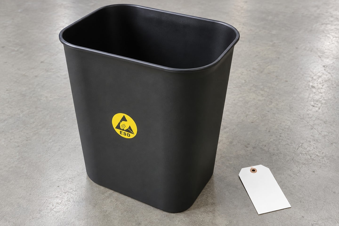 Open rim and interior of the SWESD black ESD waste bin during receiving inspection