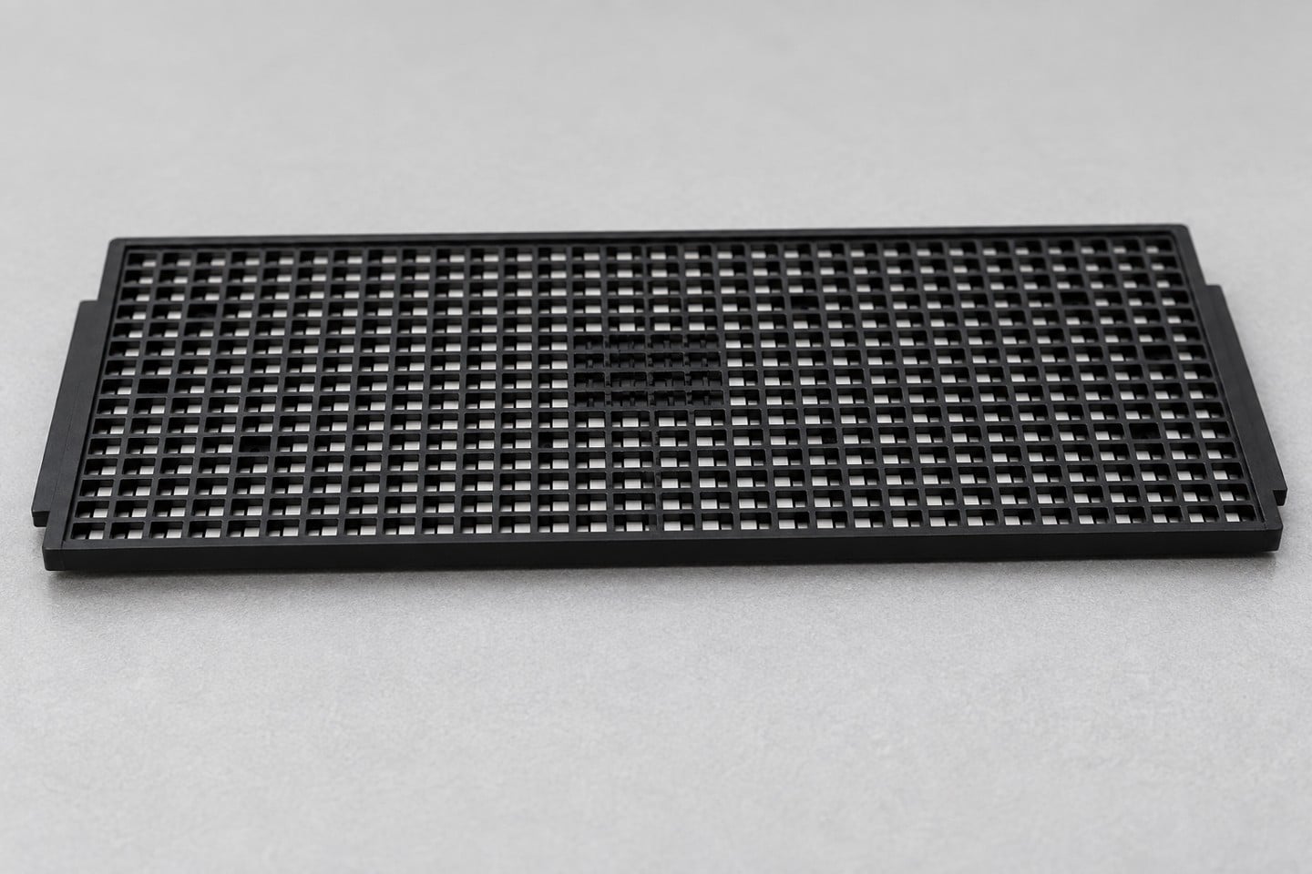 Pocket grid and perimeter of the black SWESD IC tray