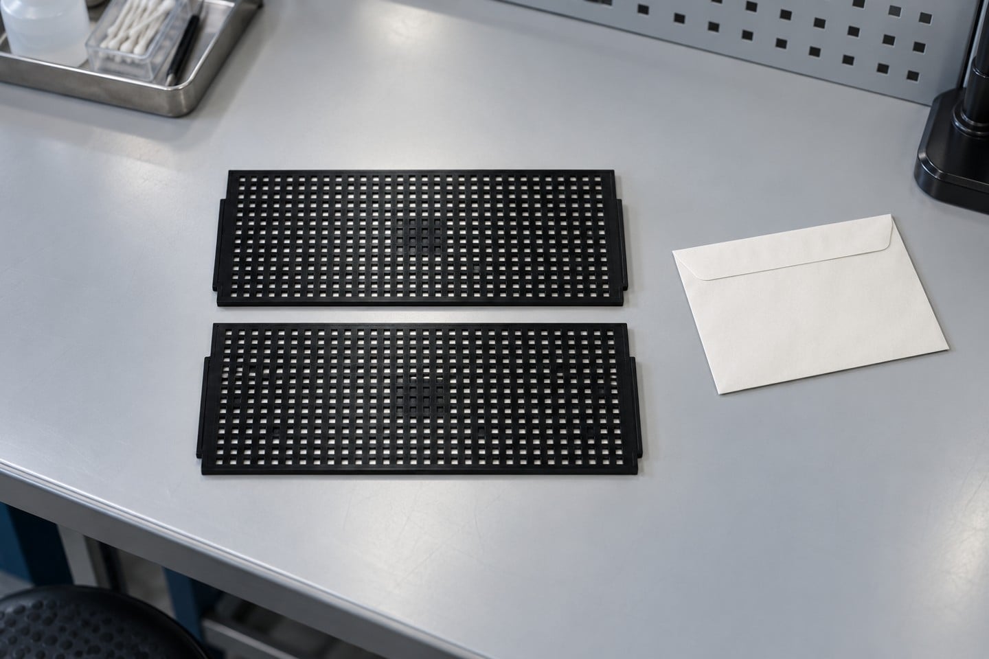 Two empty SWESD IC trays separated for identification and condition review