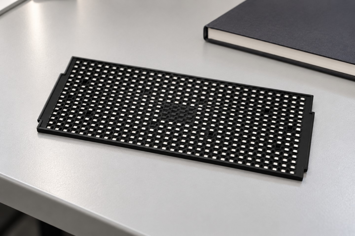 Empty SWESD IC tray beside a closed inspection notebook