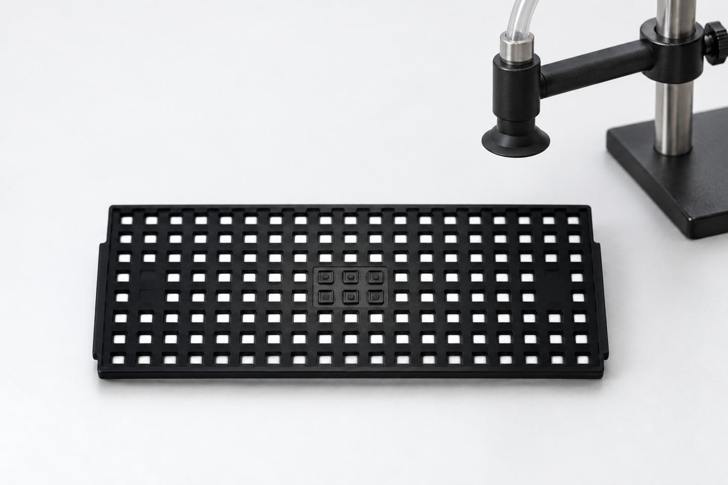 Black SWESD matrix tray with a noncontact nozzle setup illustration
