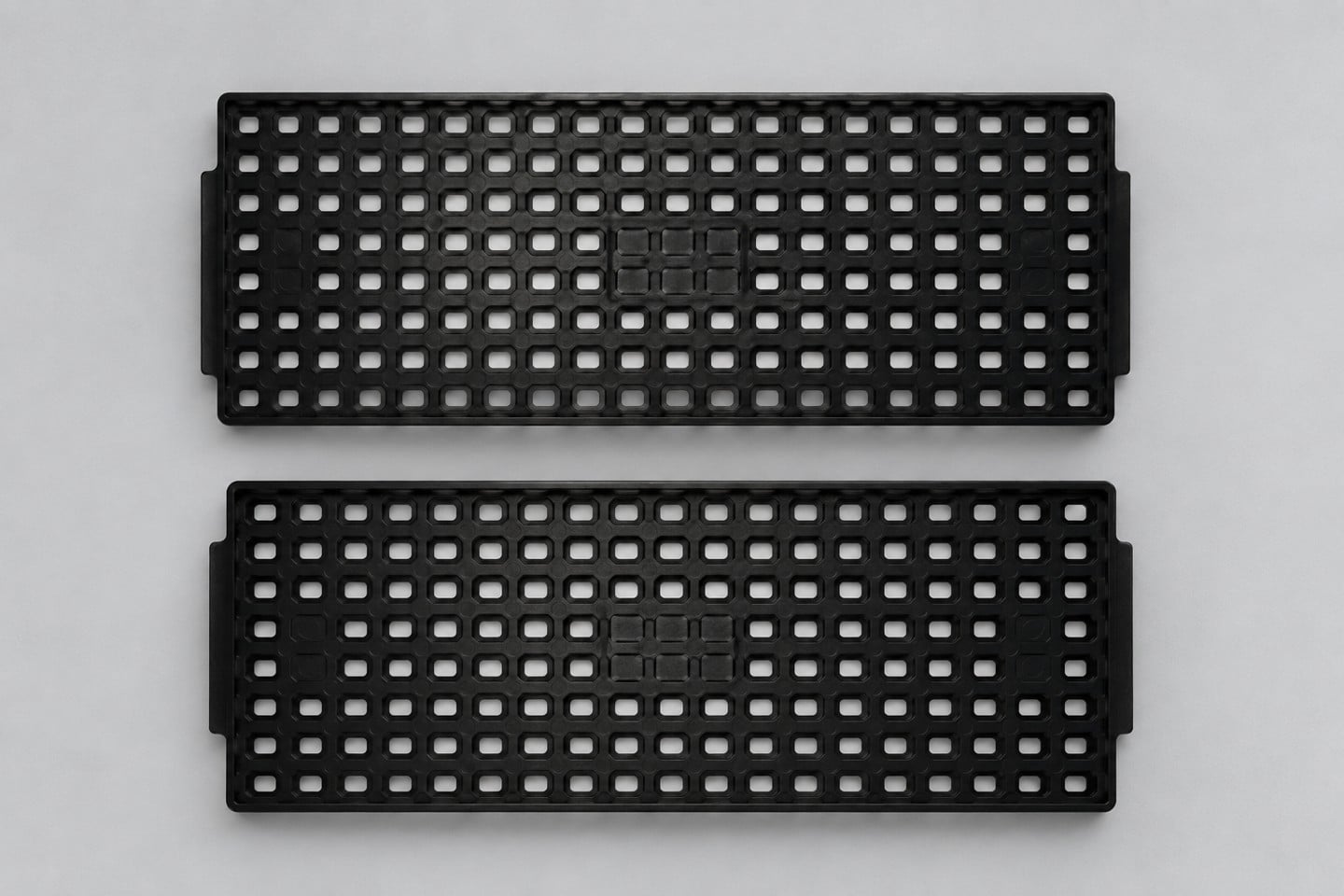 Black SWESD matrix trays separated for an engineering comparison